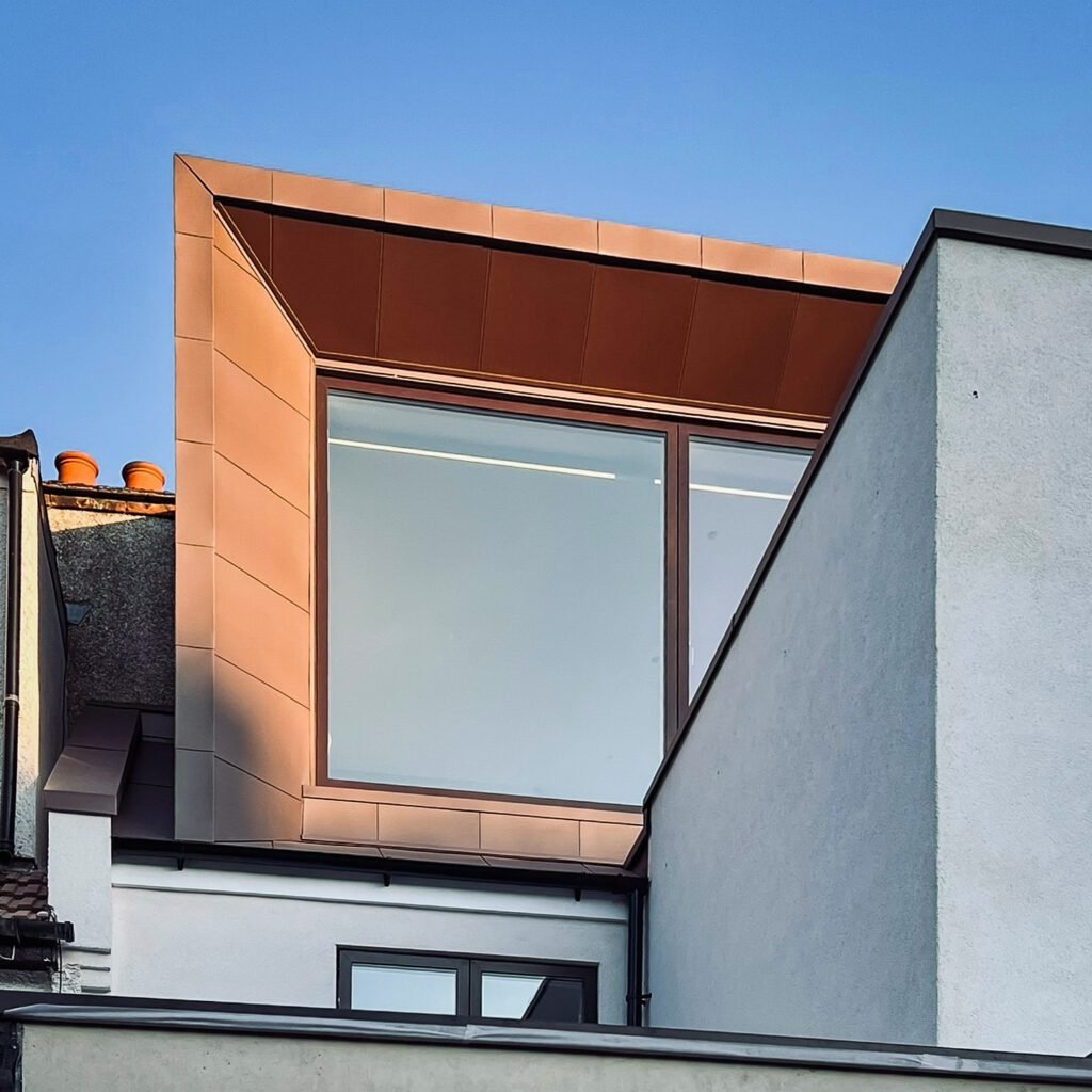 CDJM Architects modern dormer loft extension showing increased headroom, contemporary exterior finishes and improved natural light