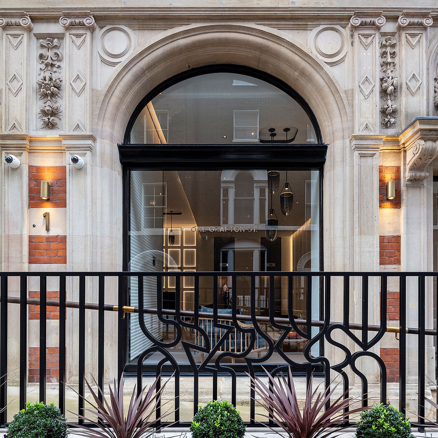Refurbished street frontage of 1 Grafton Street in Mayfair, London showing restored historic façade and elegant design