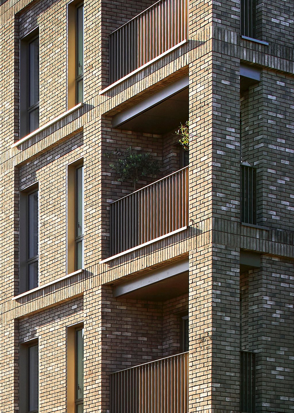 View of the completed mixed-use development on Harrow Road, Westminster, with retail at ground floor and apartments above