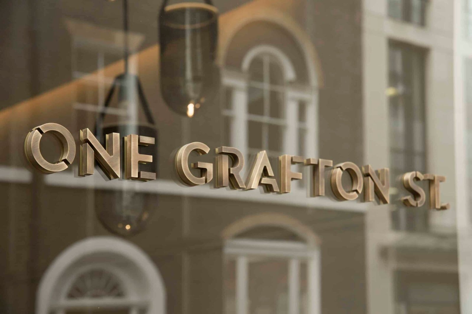 Refurbished street frontage of 1 Grafton Street in Mayfair, London showing restored historic façade and elegant design